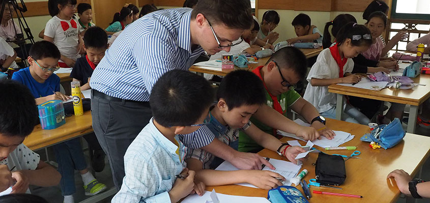 Service learning student Austin Steinman engages students in Nanjing China 