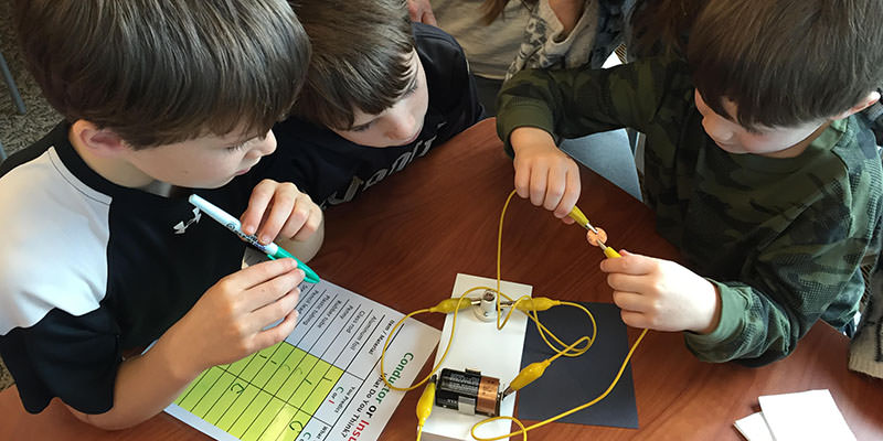 Young learners comparing conductors and insulators